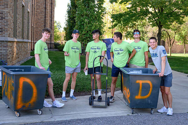 Hall staff wait to help First Year students move in, Welcome Weekend 2022